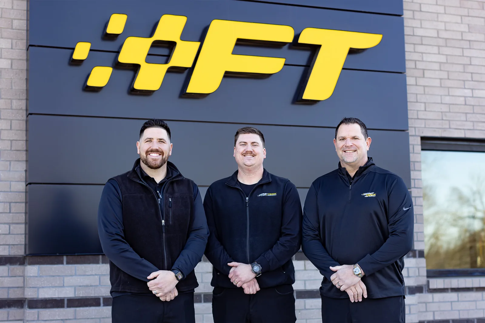 The Fast Track Tire and Service team outside the Highway 75 location